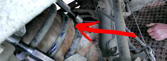 Russians Rescue Cat Stuck In Their Car Suspension Spring After Riding 40 Miles. Wow!