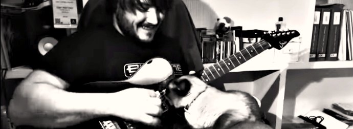 She Wanted To Be A Guitar-Hero Cat, So She Made Her Rockstar Cat-Dad Show Her The Strings